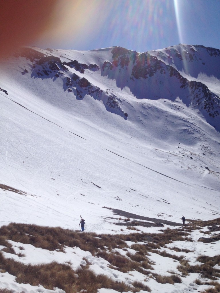 John and Pow hiking up Craigieburn ski field