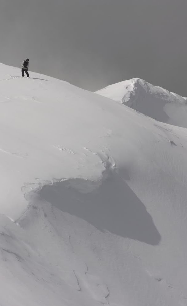 Preparing to snowboard into Big Crow Basin in the Crystal Mountain Backcountry