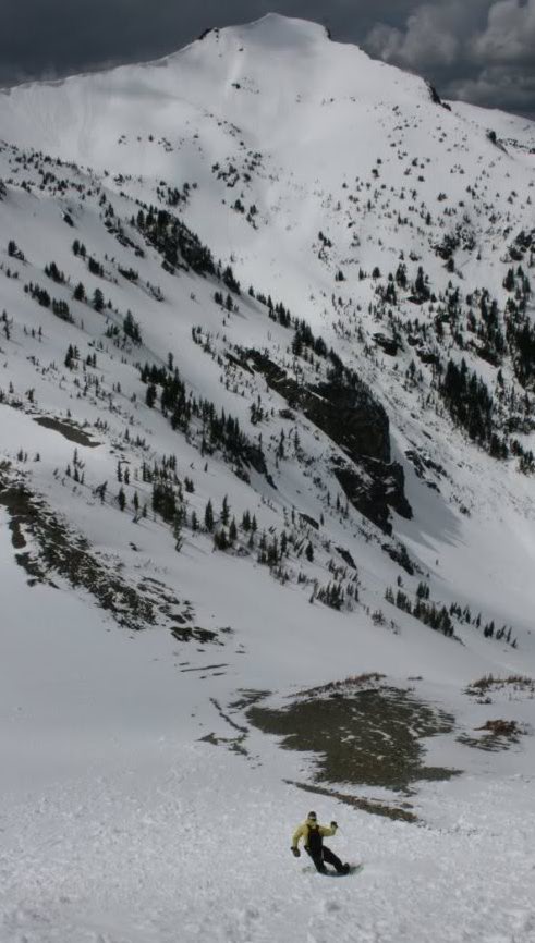 Snowboarding down Mount Aix near Bumping Lake in Washington