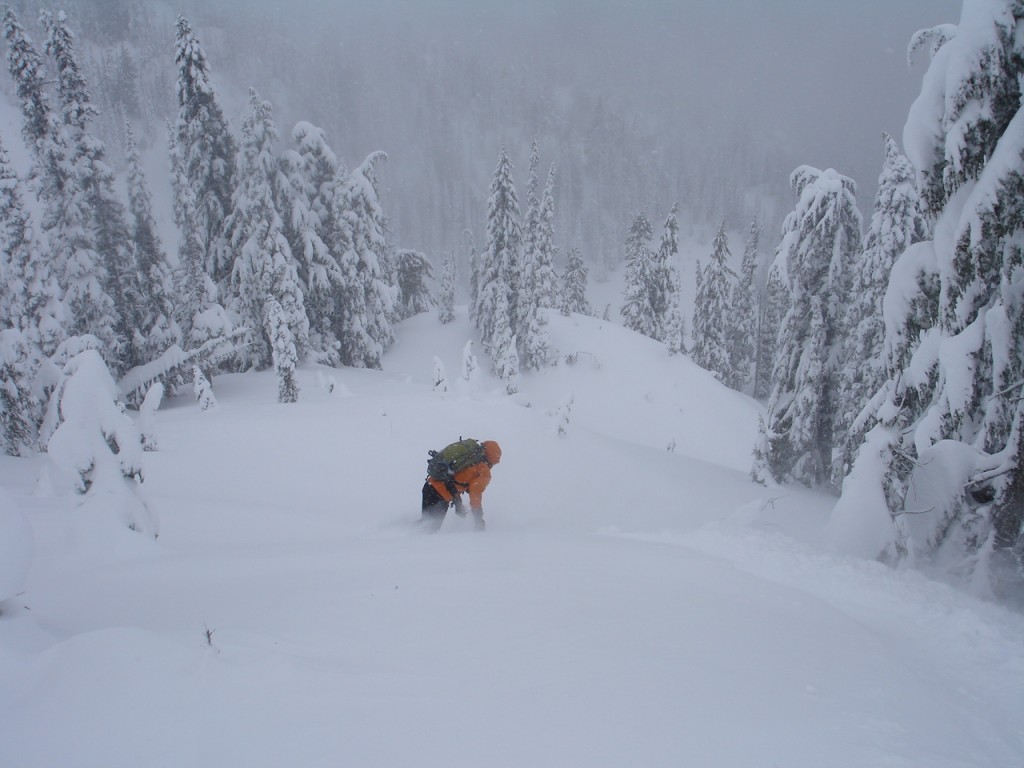 John dropping into the steep trees of Gunbarrel Ridge in Silver Basin in the Crystal Mountain Backcountry