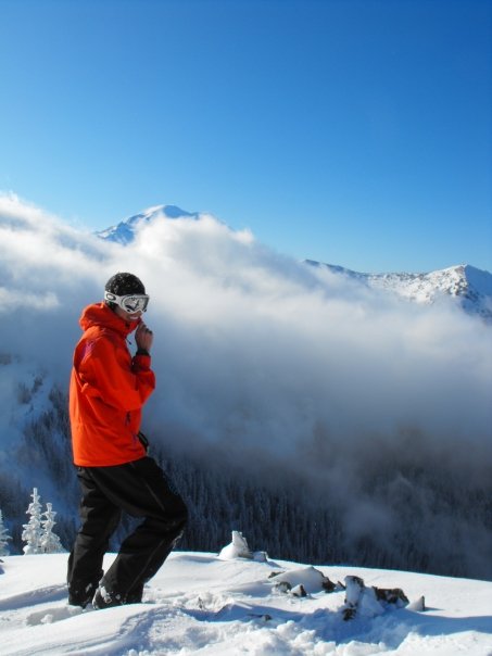 Standing on the summit of Crown Point with Rainier in the distance