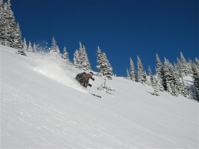 Dan enjoying our second lap of bluebird pow on East Peak