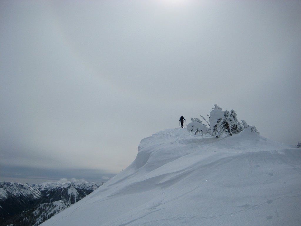 Ski touring to the top to East Peak in Crystal Mountain Backcountry