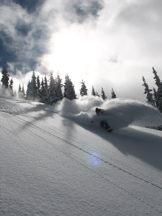 Perfect powder snowboarding in the Crystal Mountain ski resort Backcountry near Cement Basin, Lake Basin and East Peak