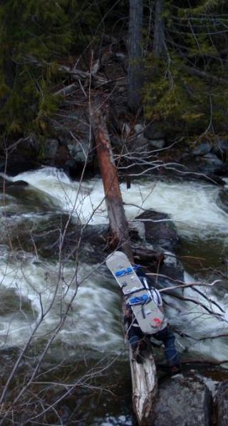 Crossing Icicle Creek after snowboarding Cannon Mountain