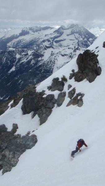 Snowboarding down Seven Fingered Jack in Glacier Peak Wilderness