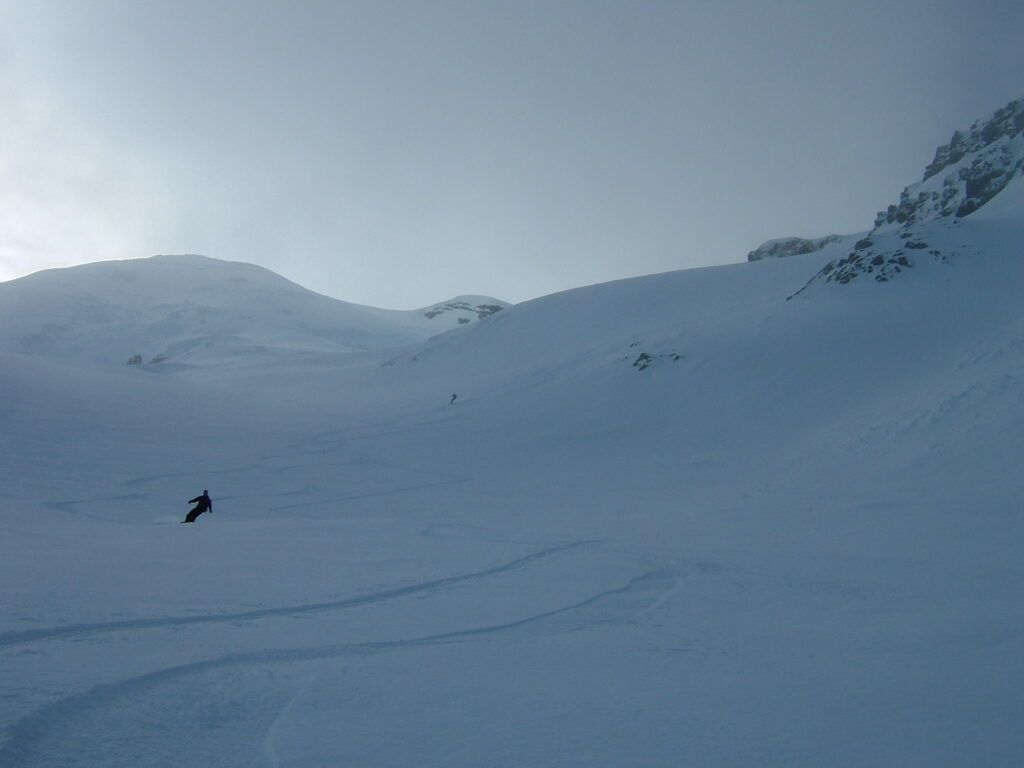 Enjoying the open slopes below in powder conditions on the Emmons Glacier