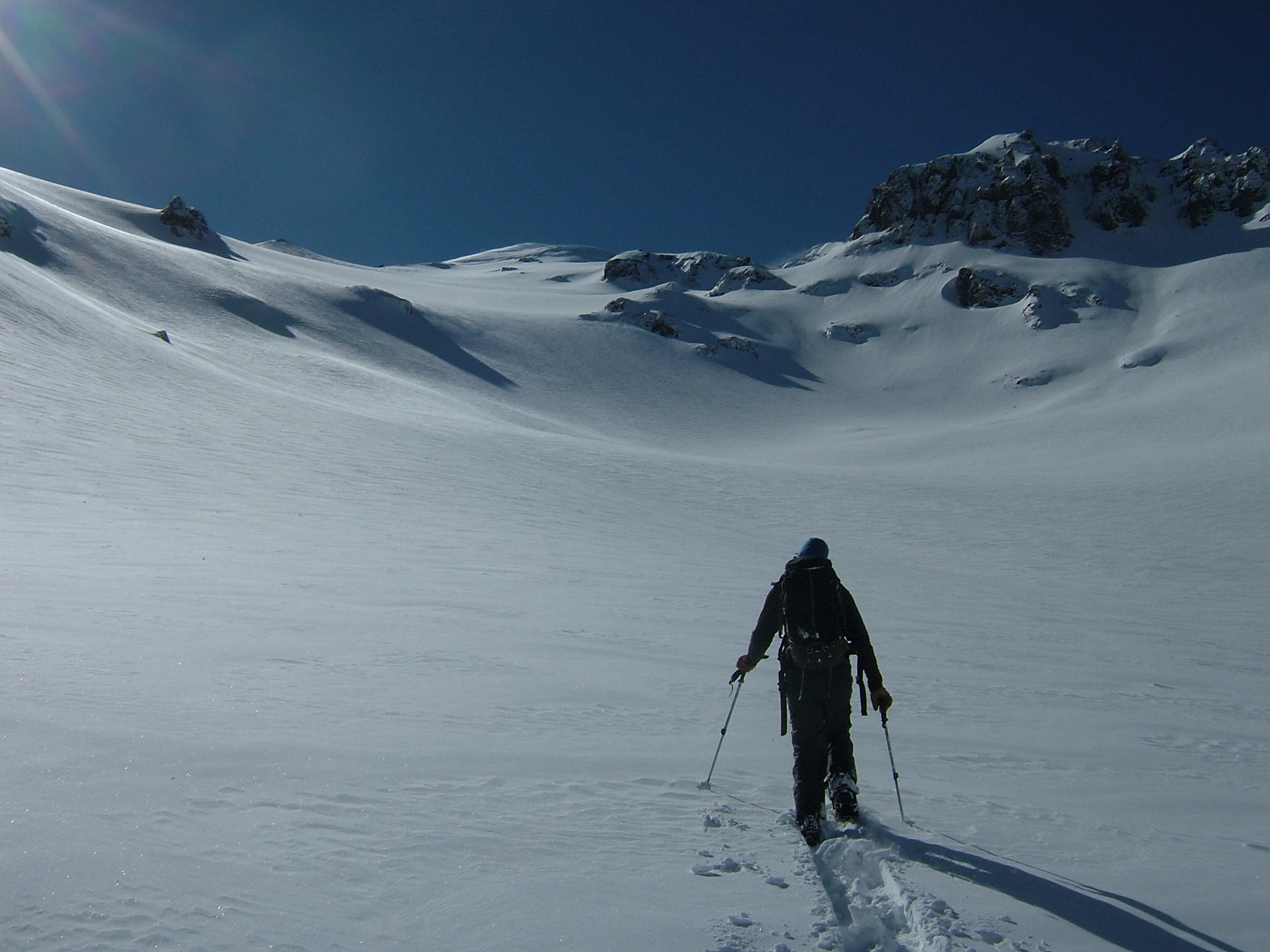 Ski touring up glacier basin to do some snowboard on the Interglacier in early spring