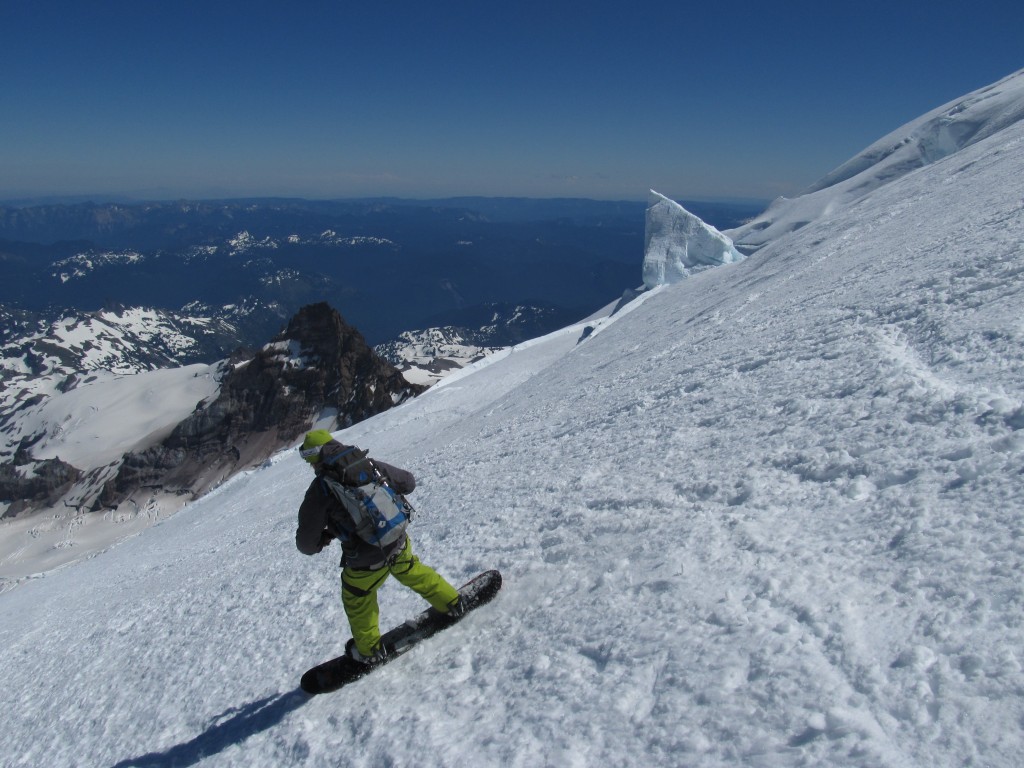 Snowboarding down the upper Emmons Glacier in August