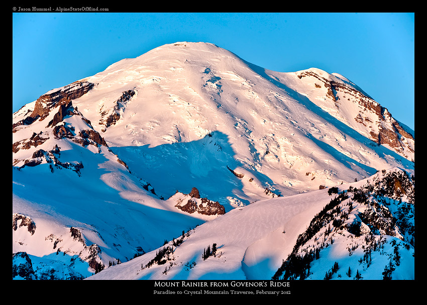 Sunrise on Mount Rainier from the summit of Governor's Ridge on a ski traverse from Paradise to Crystal Mountain Ski in Mount Rainier National Park