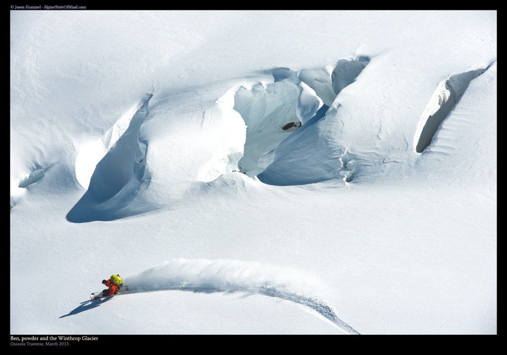 Snowboarding next to a crevasse in Mount Rainier National Park during the Osceola Traverse