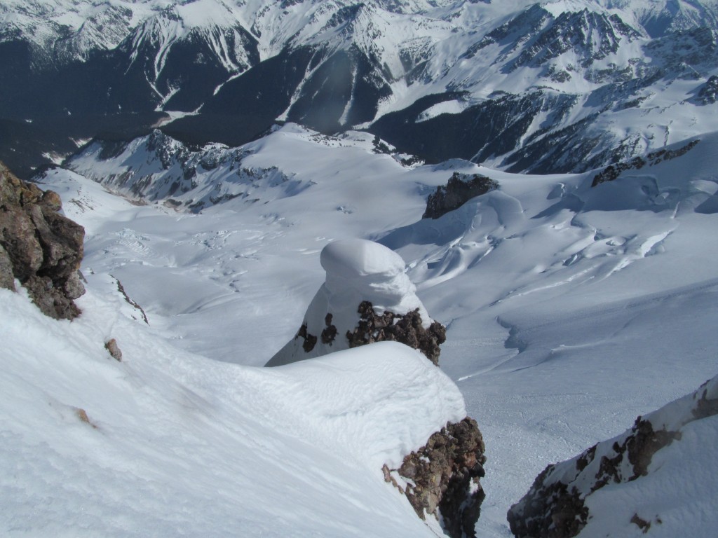 Looking down on the Chocolate Glacier and Ten peak from Glacier Peak Summit before riding the Scimitar Glacier