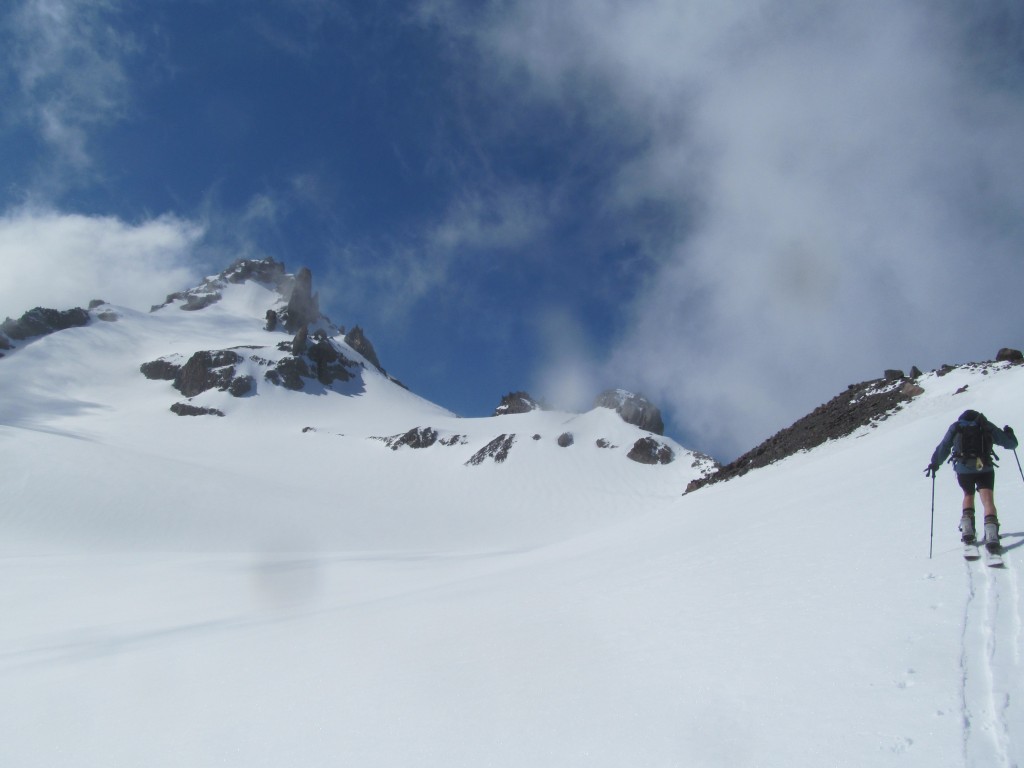 Boot skinning up the Whitman Glacier with Little Tahoma to the right and the Crest to the left.