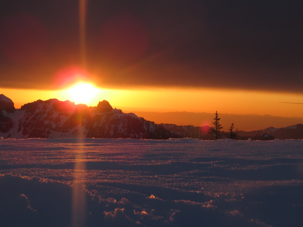 The sunsetting over Mother Mountain and the Olympic Range during the Paradise to Carbon River ski traverse