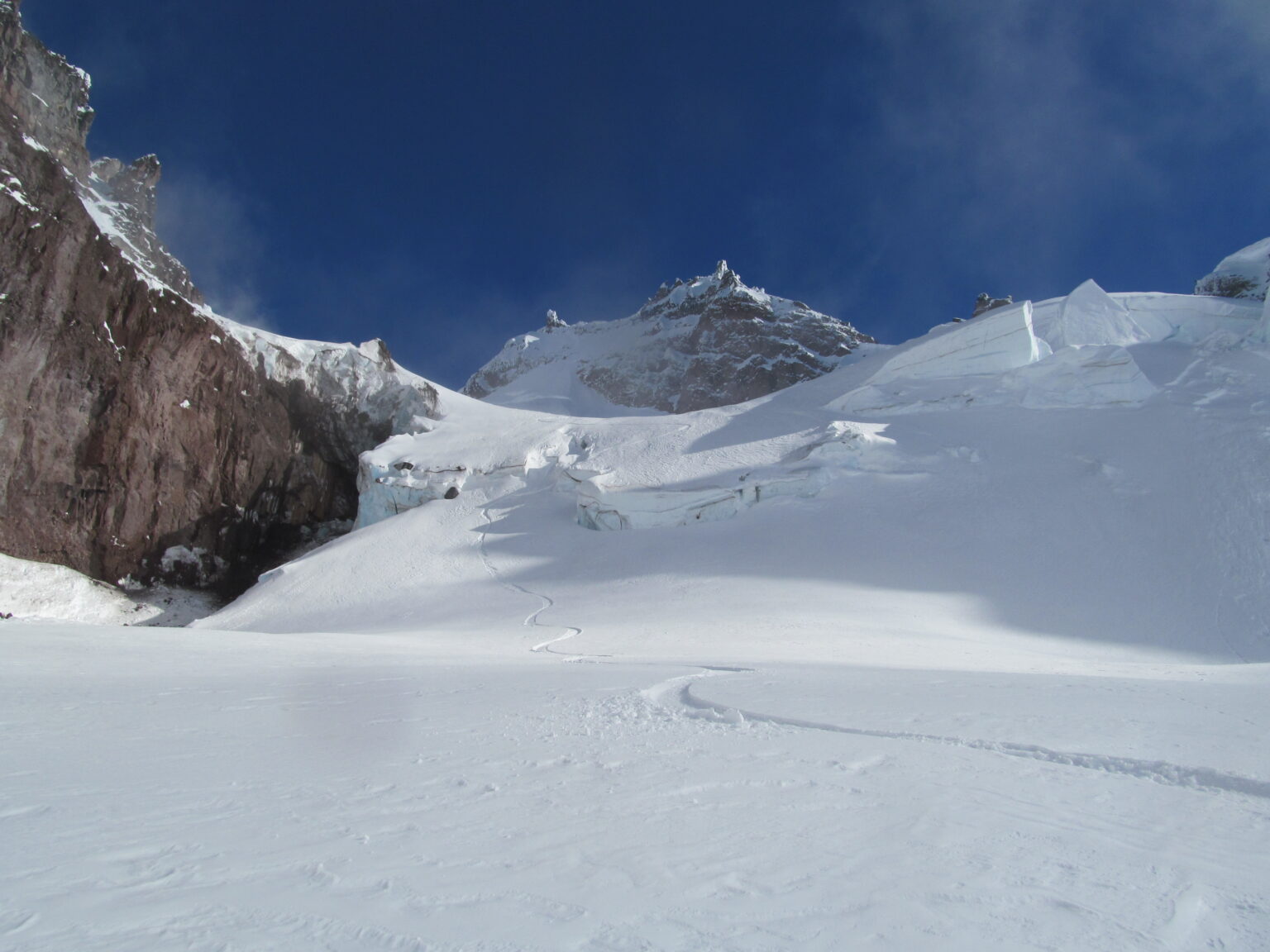 Snowboarding down the Schimitar Glacier on Glacier Peak
