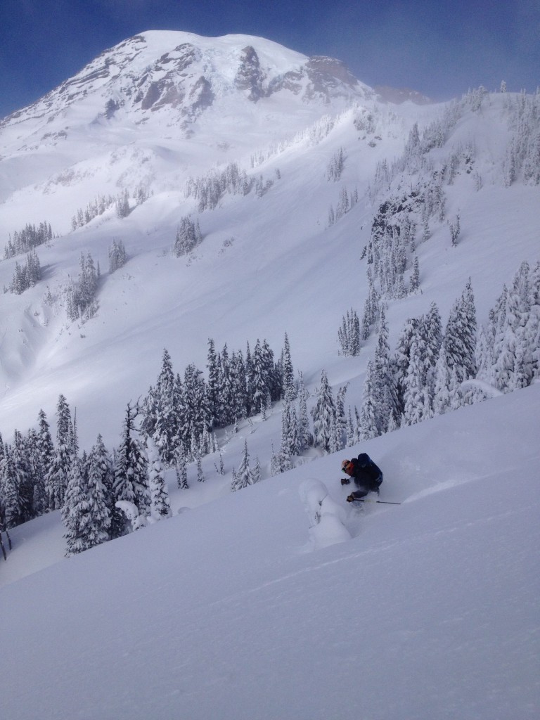 Zach enjoying skiing Edith Creek with Rainier in the background