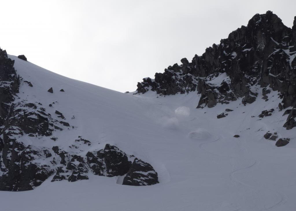 Snowboarding down the East face of the 3rd Burrough on the Sunrise and Sourdough Traverse