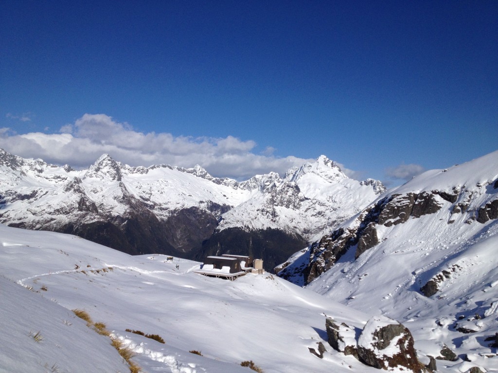 Routeburn Shelter with the mountains of Fiordland in the distance