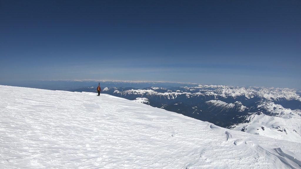 Standing on the summit of Mount Baker and heading towards the Park Glacier while doing the Watson Traverse