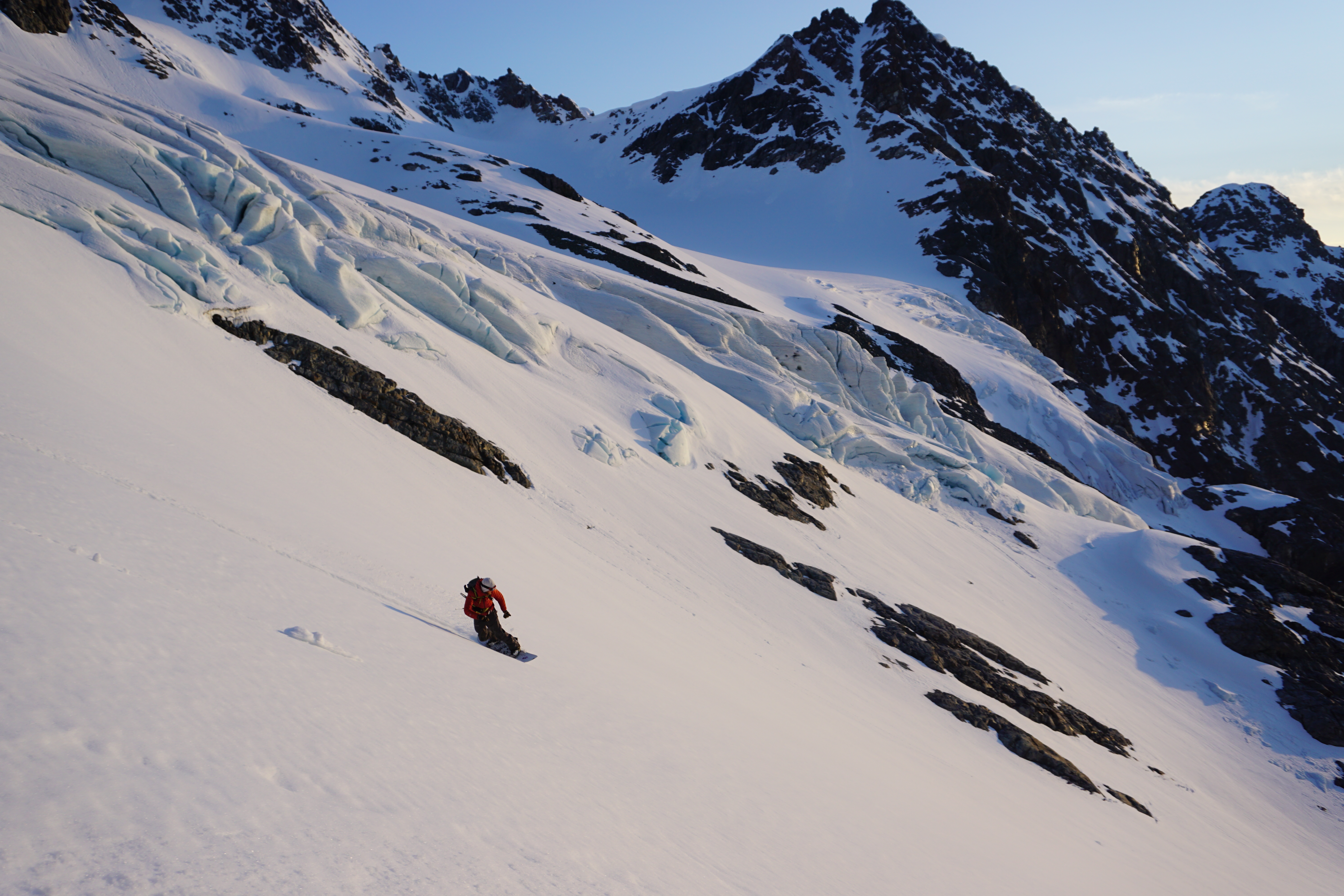 Snowboarding during the Midnight sun in the Lyngen Alps of Norway