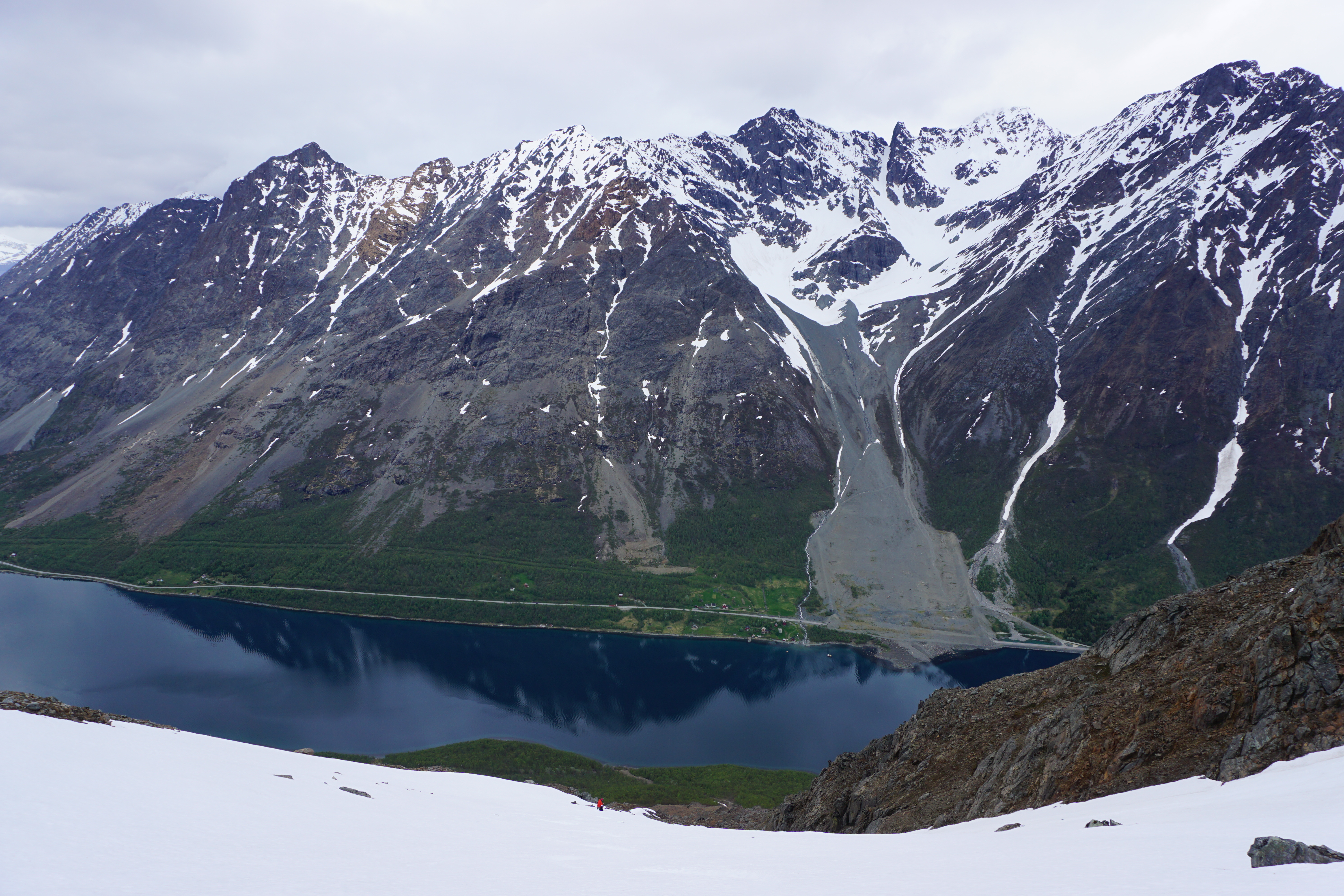 Snowboarding with a fjord below us