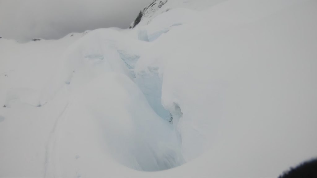 Crossing a crevasse on the Nooksack Glacier