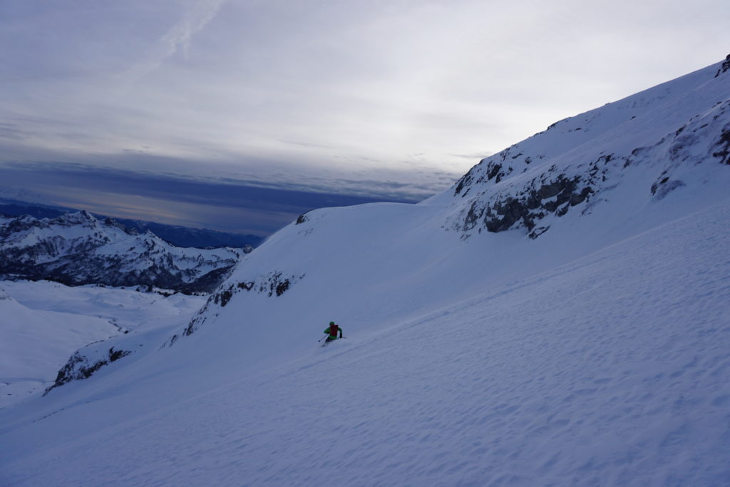 Finding great powder snow while skiing the lower slopes of the Paradise Glacier