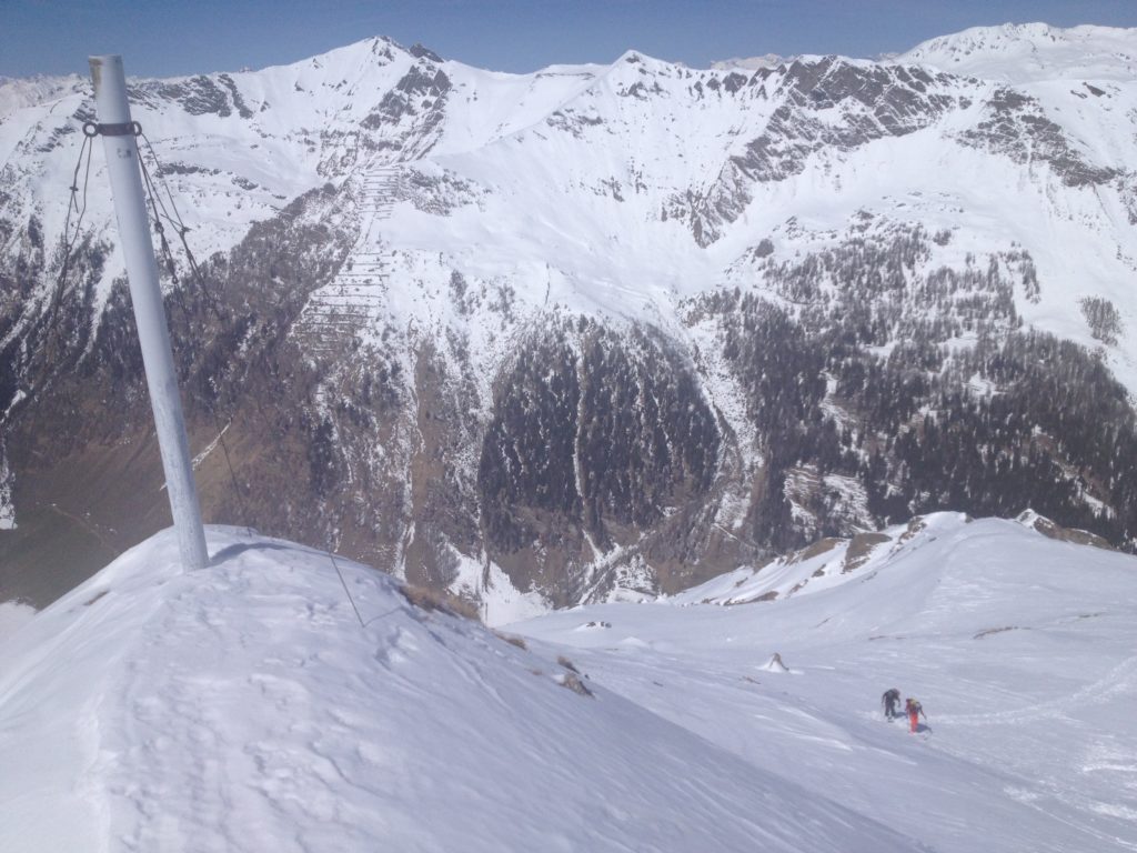 Making our way to the summit while ski touring in Austria