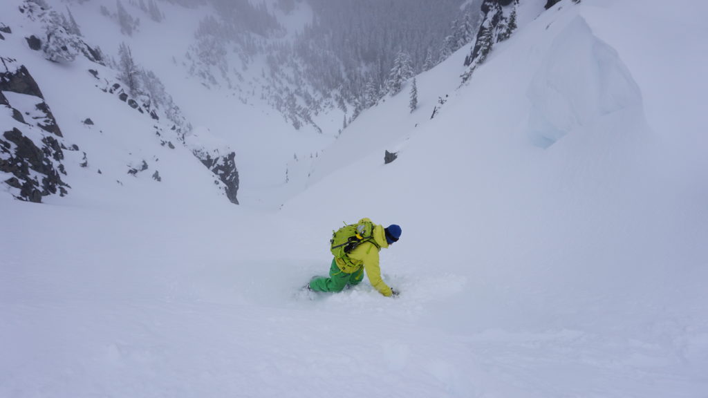 Dropping in to the secnd run of our day snowboarding Tamanos Mountain in Mount Rainier National Park