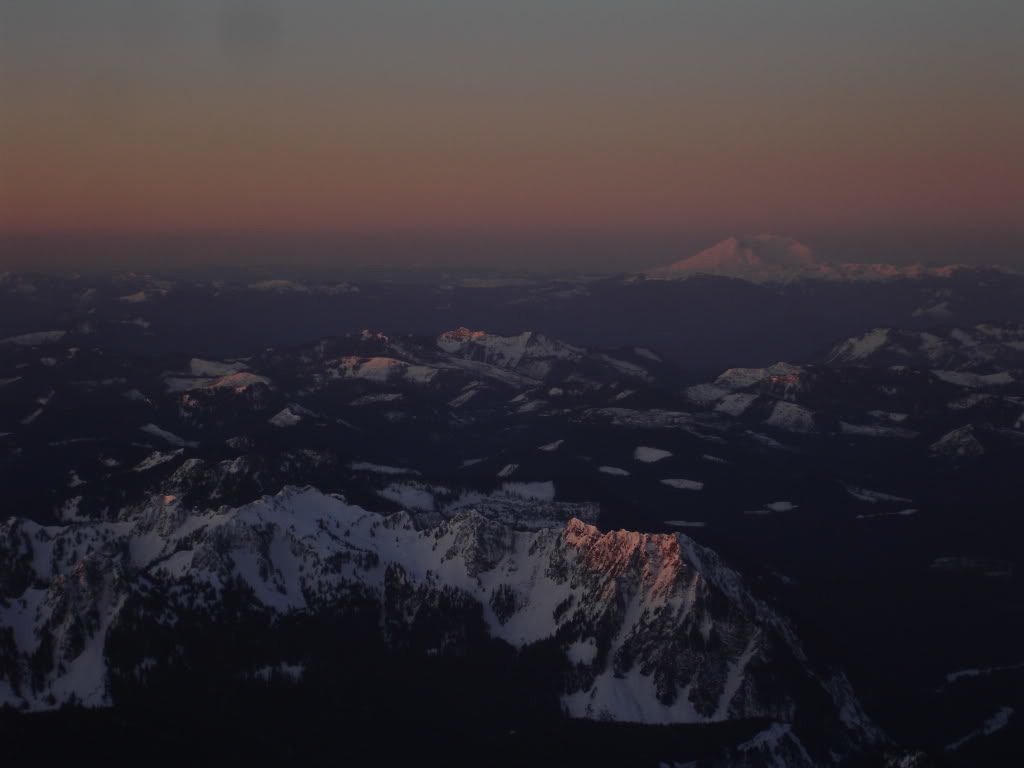 Sunrise alpenglow over the Tatoosh range and Mt Saint Helens