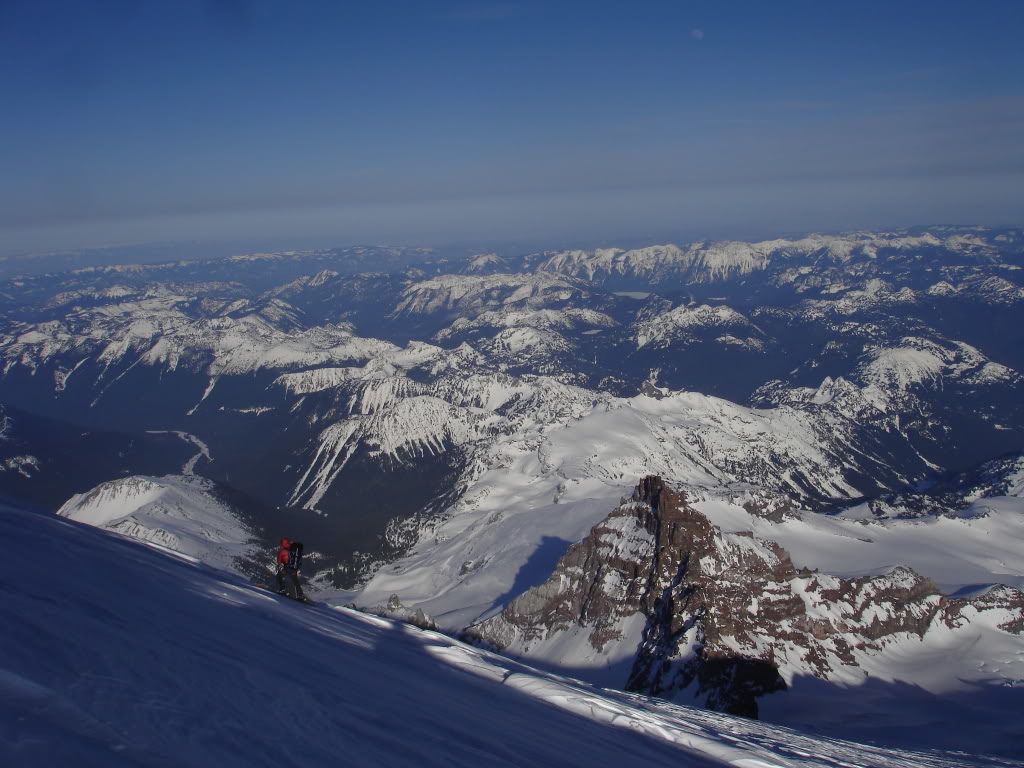 Amar skiing with Tahoma in the Background heading towards the Gib Chute 