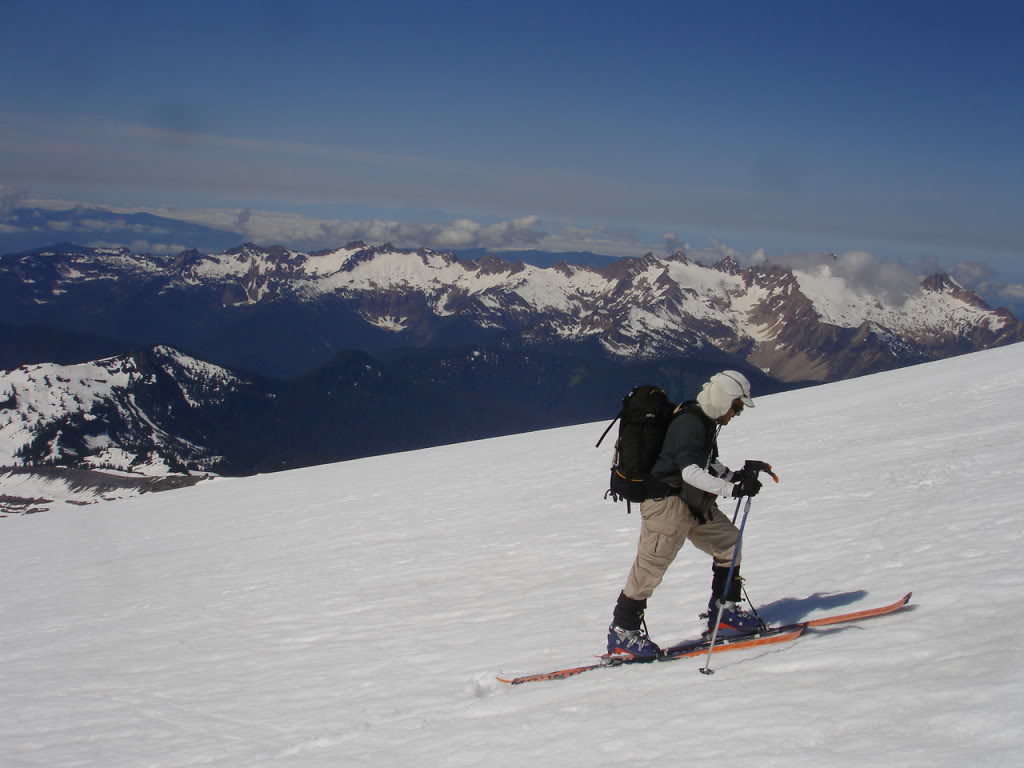 Skinning up the Squak Glacier on Mount Baker with the Sisters Range in the background