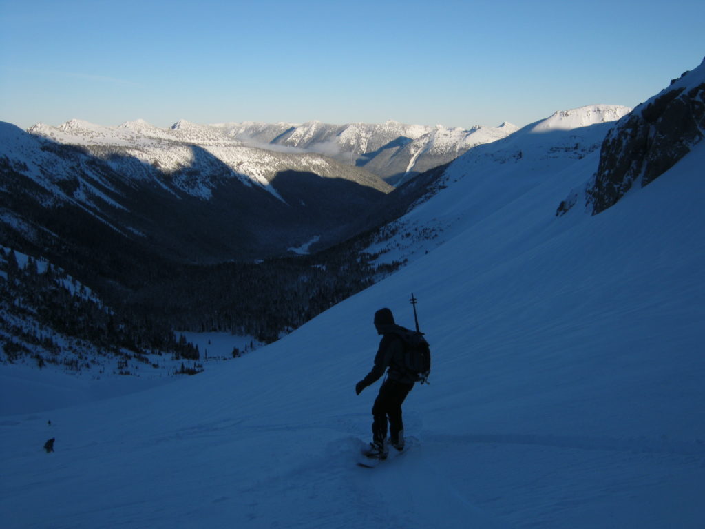 Boot taking turns into Glacier Basin and riding to the open area far in the Valley after riding the Interglacier in early spring