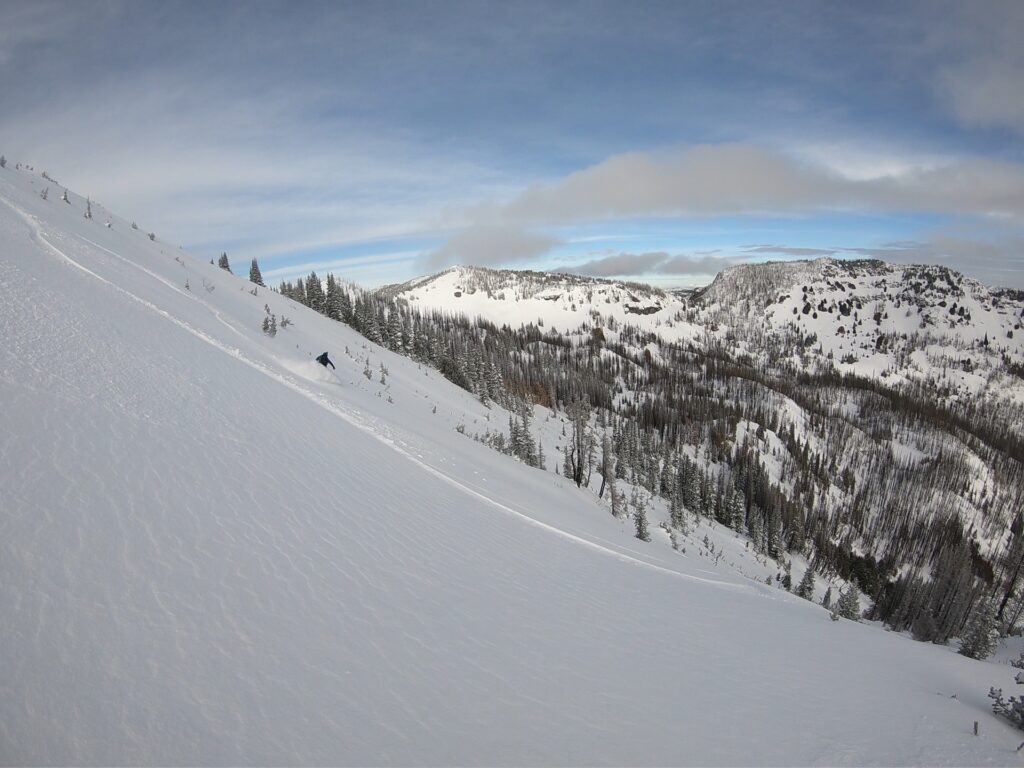 Boot laying snowboard tracks down Cement Basin