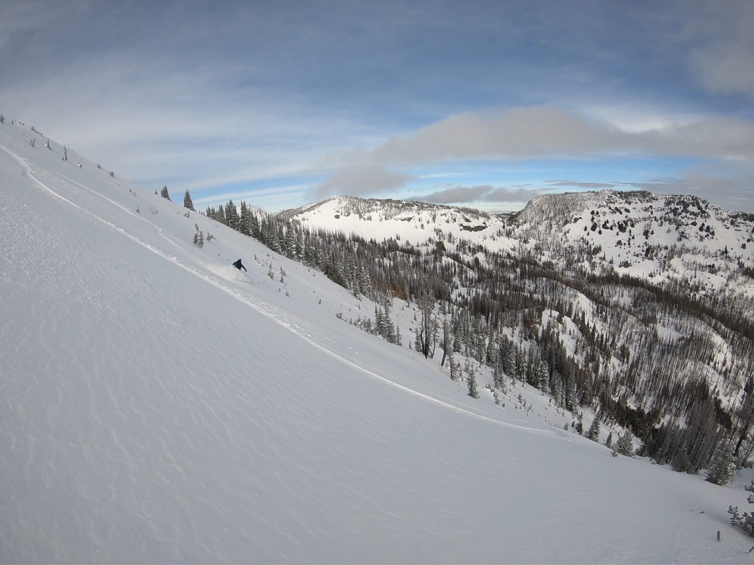 Boot laying snowboard tracks down Cement Basin