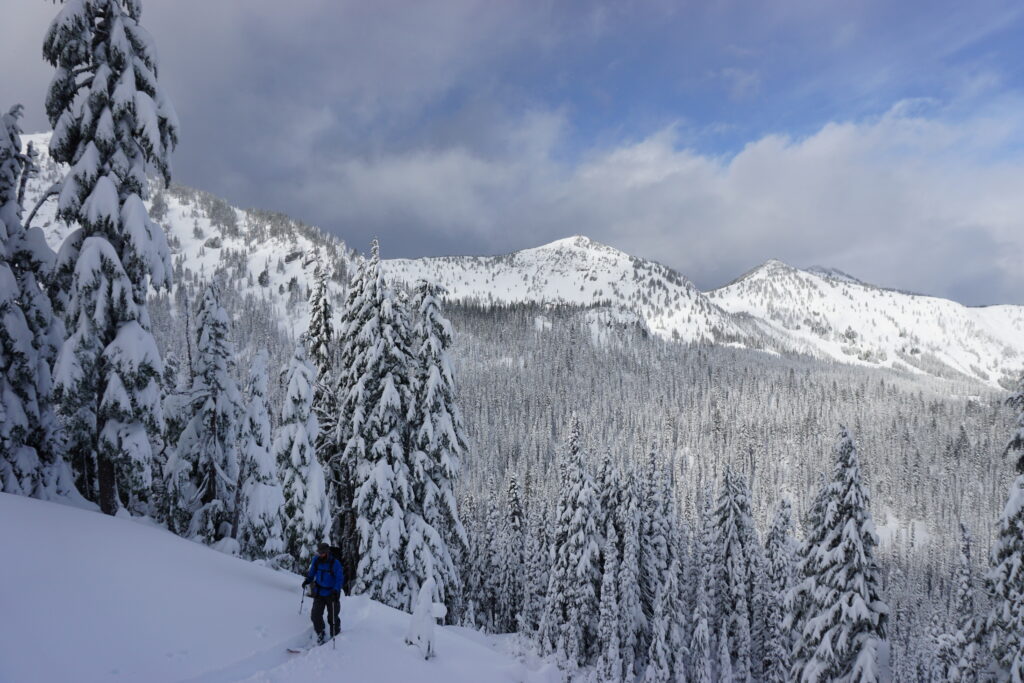 Heading up Silver Basin with the Crystal Mountains Ski resort in the distance