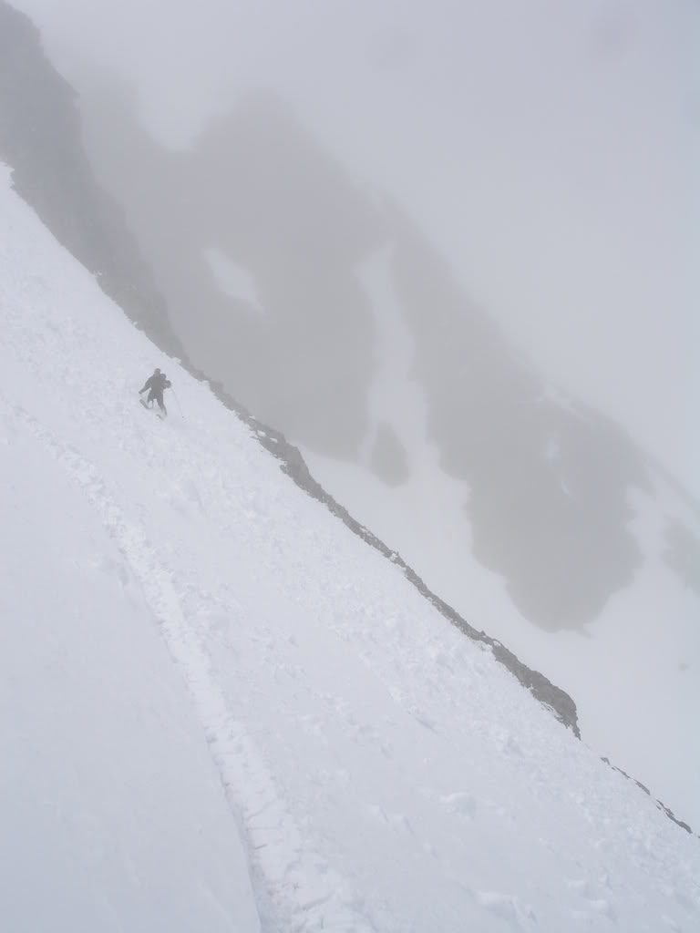 Scott skiing the lower face as the clouds roll in