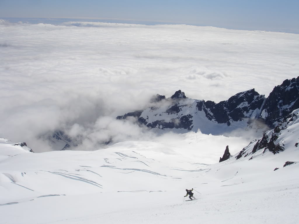 Making turns on the Roman Headwall towards the Easton Glacier from the summit of Mount Baker