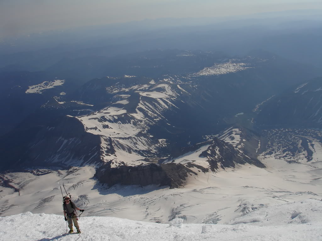 Andy climbing the Emmons Glacier with steamboat prow and the Interglacier below