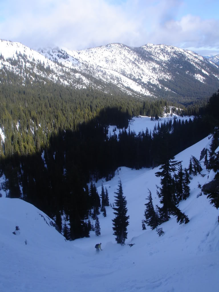 Snowboarding down the lower slope into Morse Creek from Sheep Lake Basin in the Crystal Mountain Backcountry