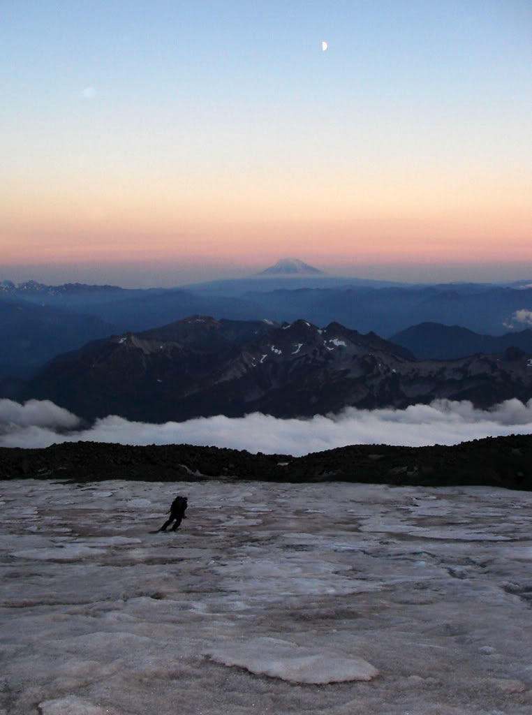 Dan skiing down in firm conditions getting September turns on the Muir Snowfield