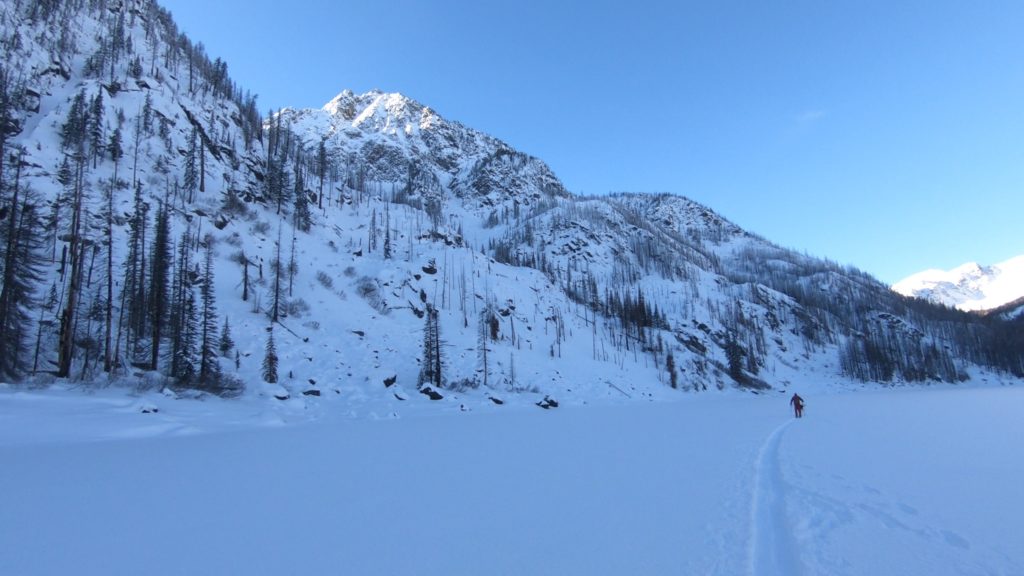 Heading across Eightmile Lake and looking for something to ski