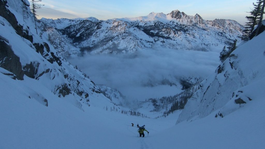 Bootpacking up the final bit of our run as clouds move over Eightmile Lake