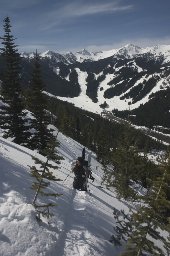 Boot packing up East Peak with Crystal Mountain in the background