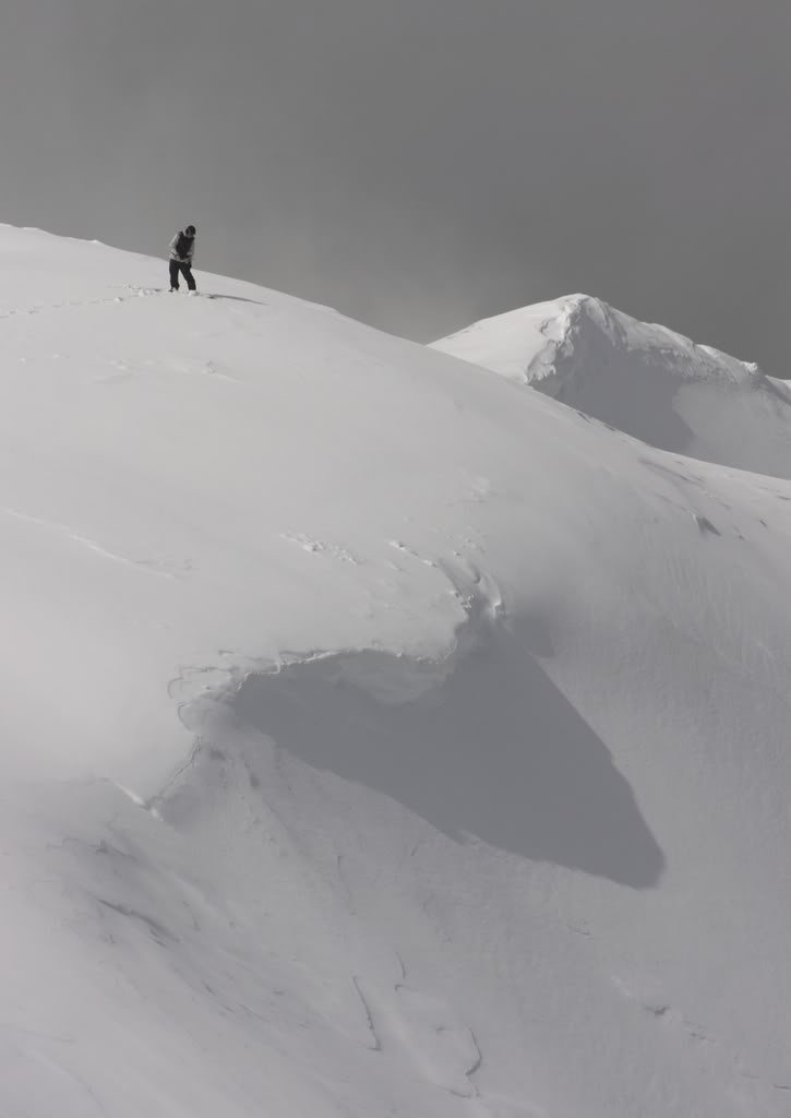 Preparing to drop into Big Crow Basin in the Crystal Mountain Backcountry