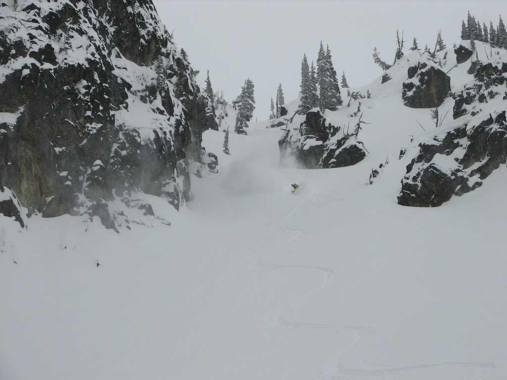 Massive rooster tails snowboarding down a chute in Crystal Lakes Basin