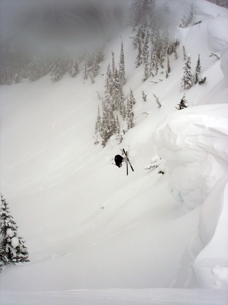 Dan doing a backflip off a massive cornice in the Dog Leg Bowl