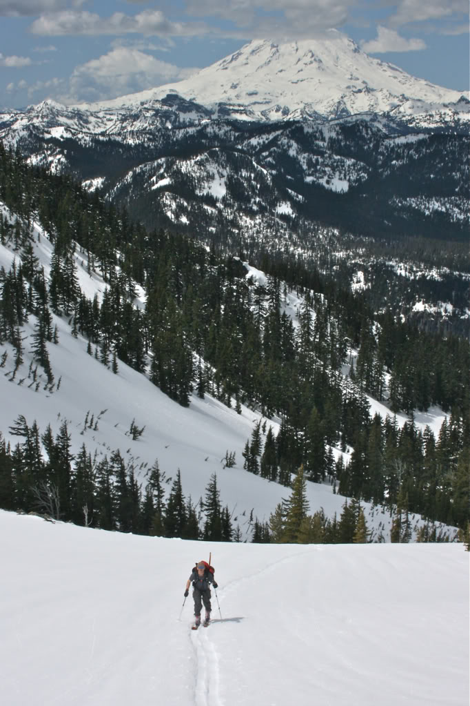 Ian skinning towards Mt. Aix with Rainier in the background