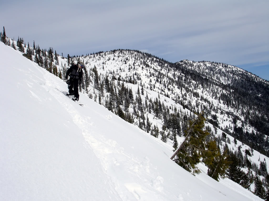 Kyle dropping into the South face of Pickhandle Peak