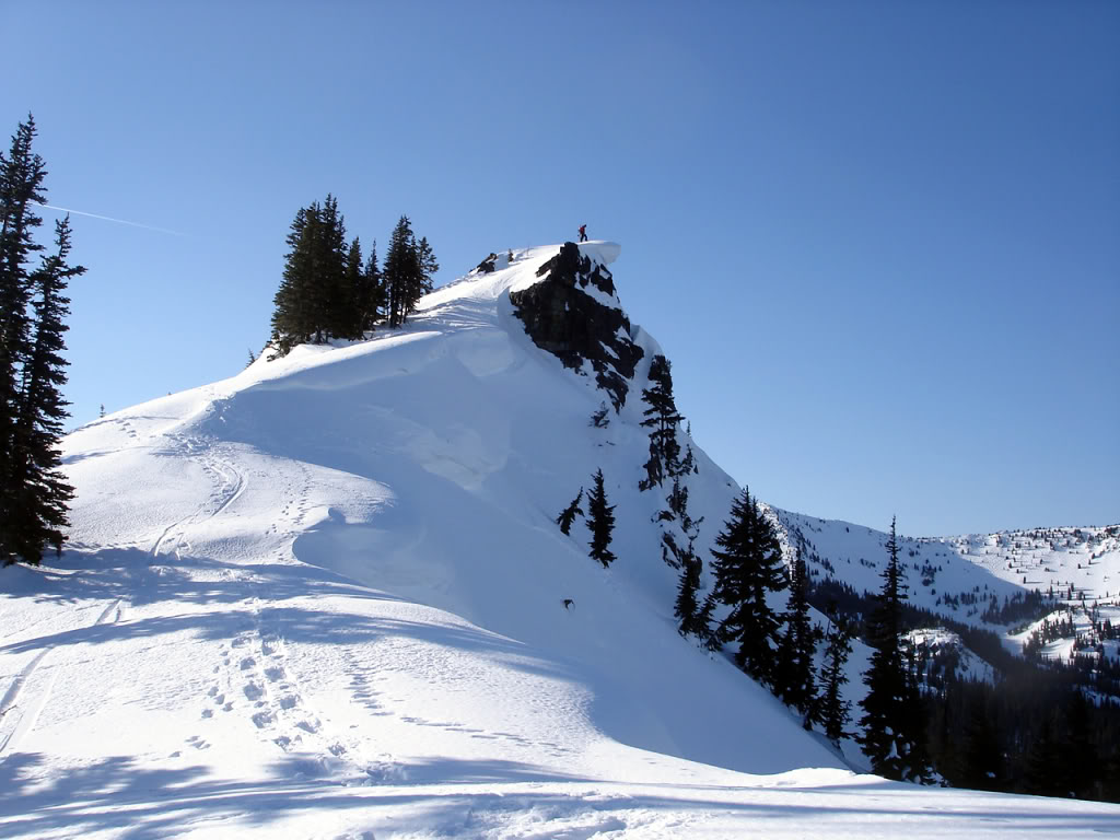 Standing on the top of the Storm Trooper just behind a cornice